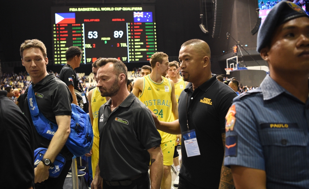 In this photo taken July 2, 2018, Australian players and officials leave the court after their FIBA World Cup Asian qualifier game against the Philippines, at the Philippine arena in Bocaue town, Bulacan province, north of Manila. / AFP / TED ALJIBE