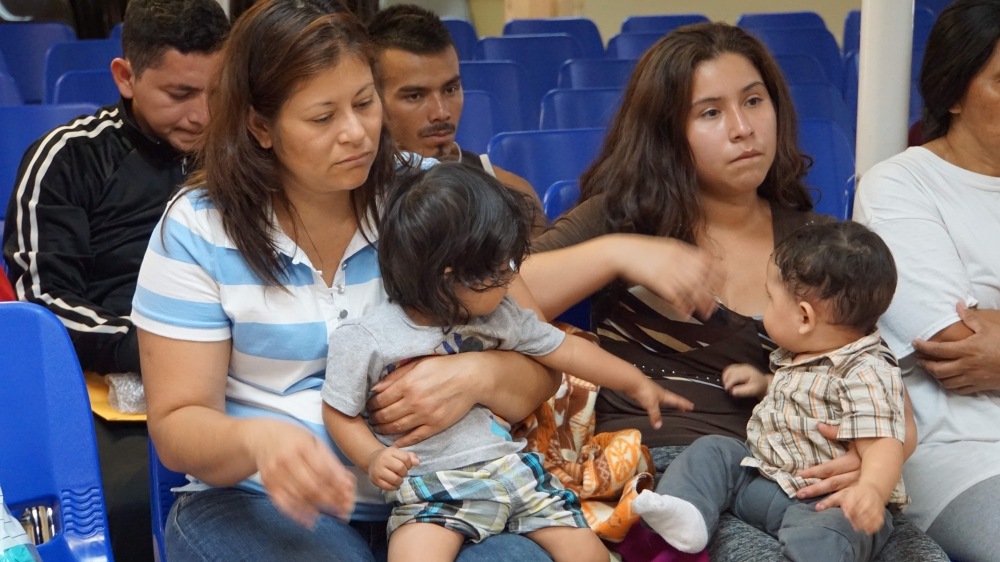 In this file photo taken on June 15, 2018 Mothers and children wait to be assisted by volunteers in a humanitarian center in the border town of McAllen, Texas. AFP / Leila Macor 
 

