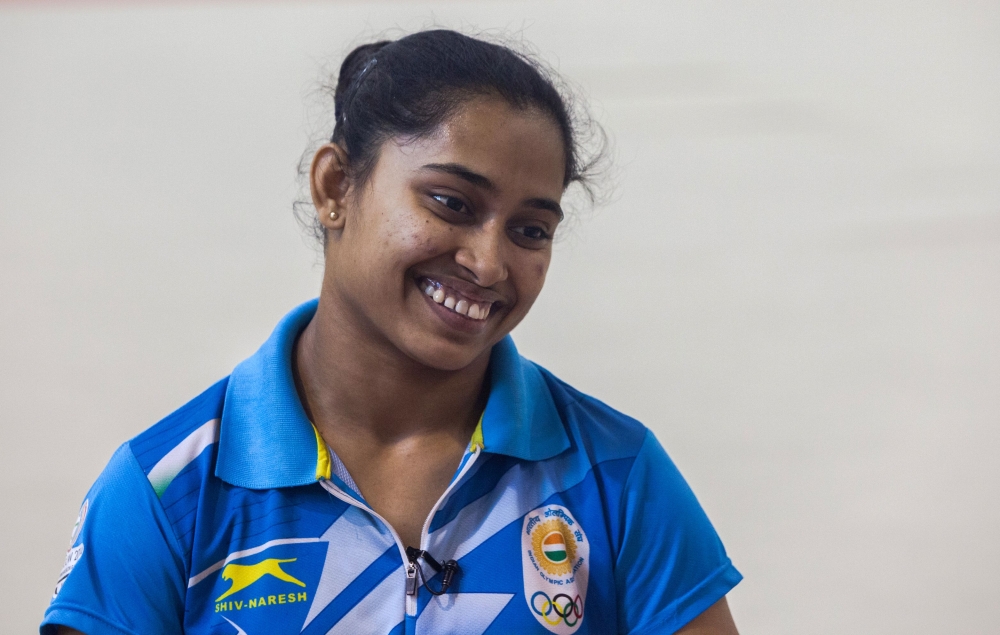 File photo of Indian gymnast Dipa Karmakar speaks during an interview with AFP at the Indira Gandhi Sports Complex in New Delhi, May 5, 2016. / AFP / Rebecca Conway 