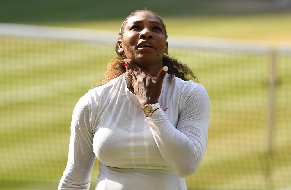 US player Serena Williams reacts while playing Germany's Angelique Kerber during their women's singles final match on the twelfth day of the 2018 Wimbledon Championships at The All England Lawn Tennis Club in Wimbledon, southwest London, on July 14, 2018.