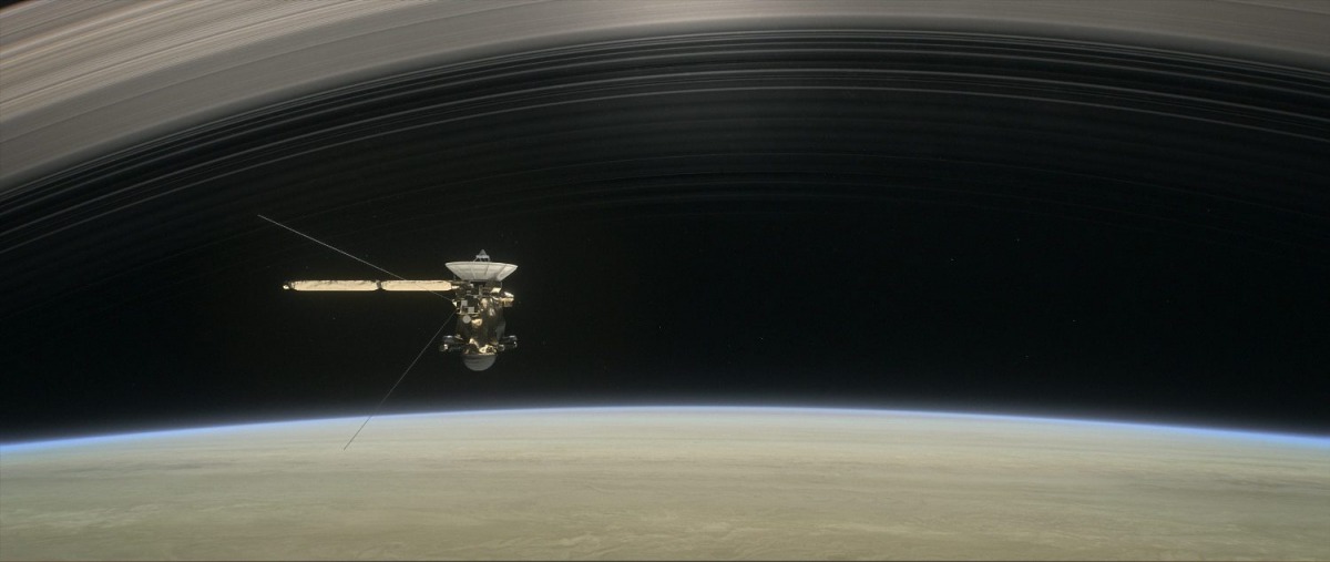 This artist's rendering shows Cassini as the spacecraft makes one of its final five dives through Saturn's upper atmosphere in August and September 2017.