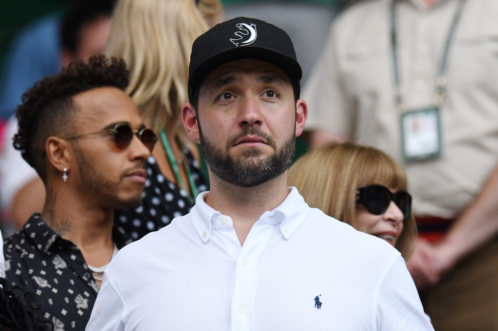Husband of US player Serena Williams, Alexis Ohanian, takes his seat on court to watch her play against Germany's Angelique Kerber in their women's final match on the twelfth day of the 2018 Wimbledon Championships at The All England Lawn Tennis Club in W