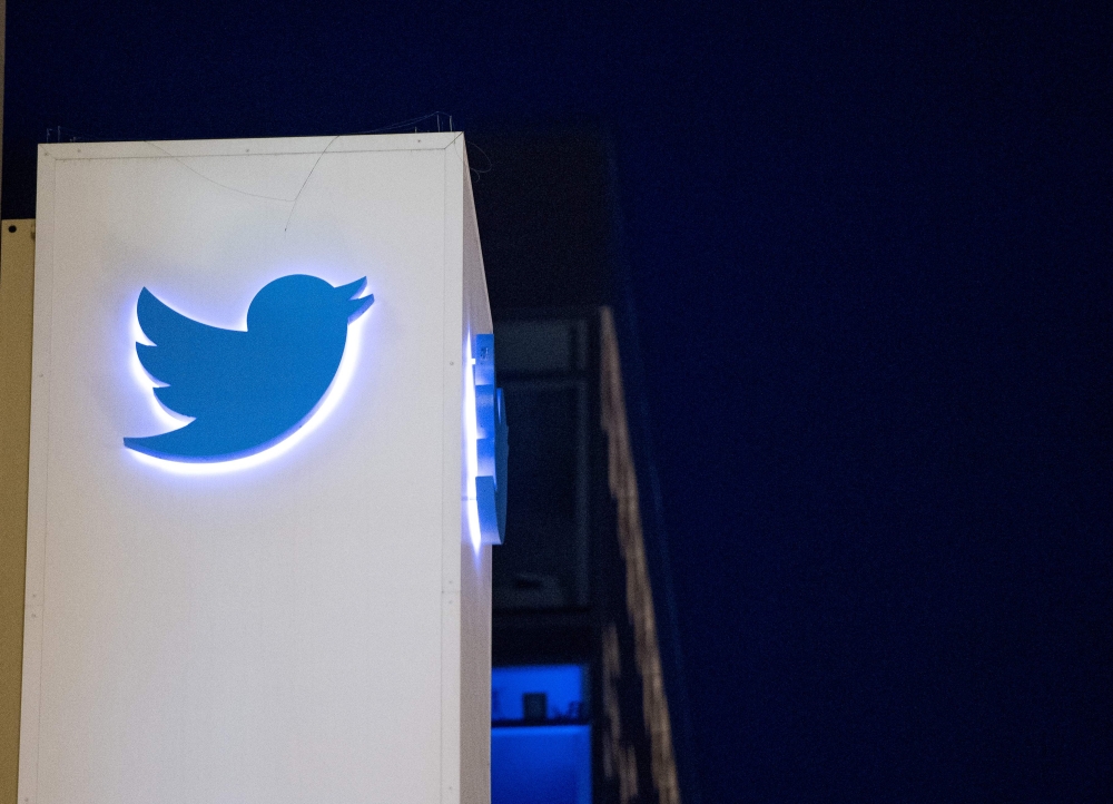 In this file photo taken on November 4, 2016, the Twitter logo is seen on a sign at the company headquarters in San Francisco (AFP / Josh Edelson) 