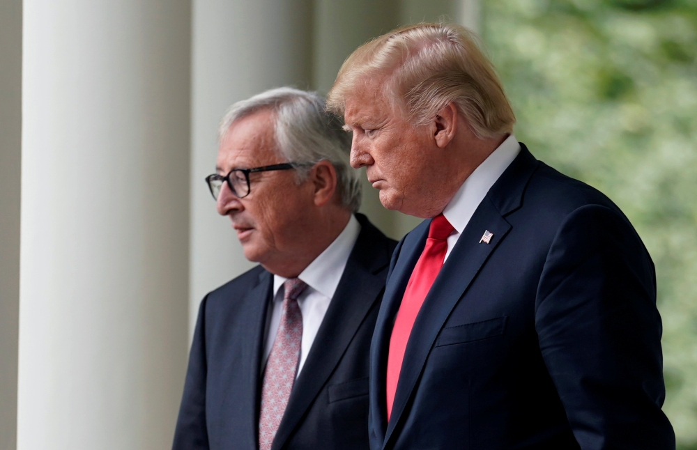 US President Donald Trump and President of the European Commission Jean-Claude Juncker walk together before speaking about trade relations in the Rose Garden of the White House in Washington, July 25, 2018. Reuters/Joshua Roberts
