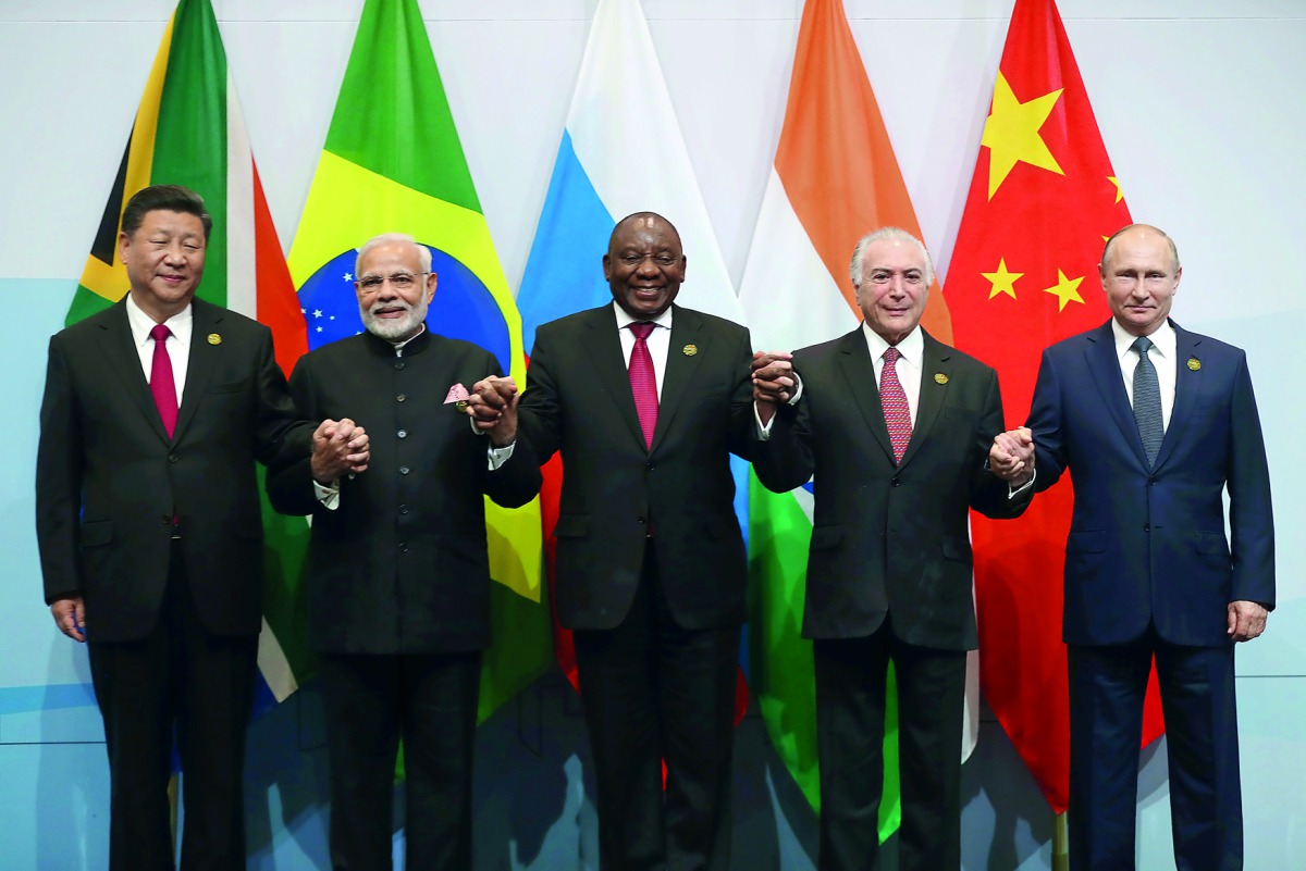 China's President Xi Jinping, Indian Prime Minister Narendra Modi, South Africa's President Cyril Ramaphosa, Brazil's President Michel Temer and Russia's President Vladimir Putin pose for a group picture at the BRICS summit meeting in Johannesburg, South 