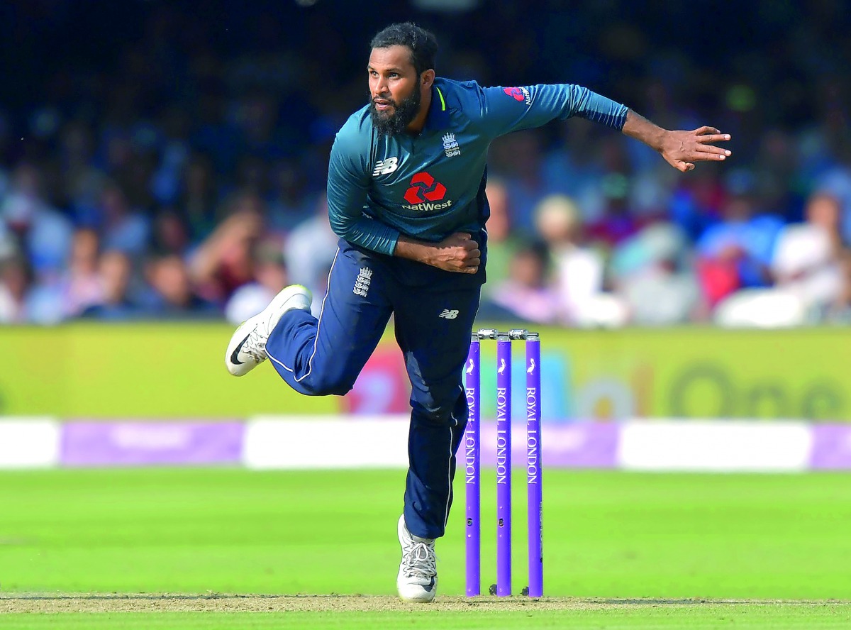 In this file photo taken on July 14, 2018 England's Adil Rashid bowls during the second One Day International (ODI) cricket match between England and India, at Lord's Cricket Ground in London. AFP / Olly Greenwood