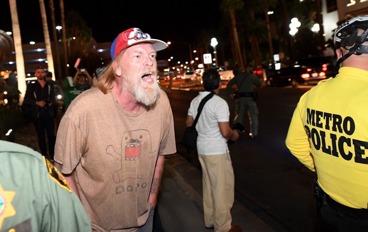 A Donald Trump supporter yells at anti-Trump protesters outside the Trump International Hotel, Las Vegas (Ethan Miller / Getty Images / AFP) 