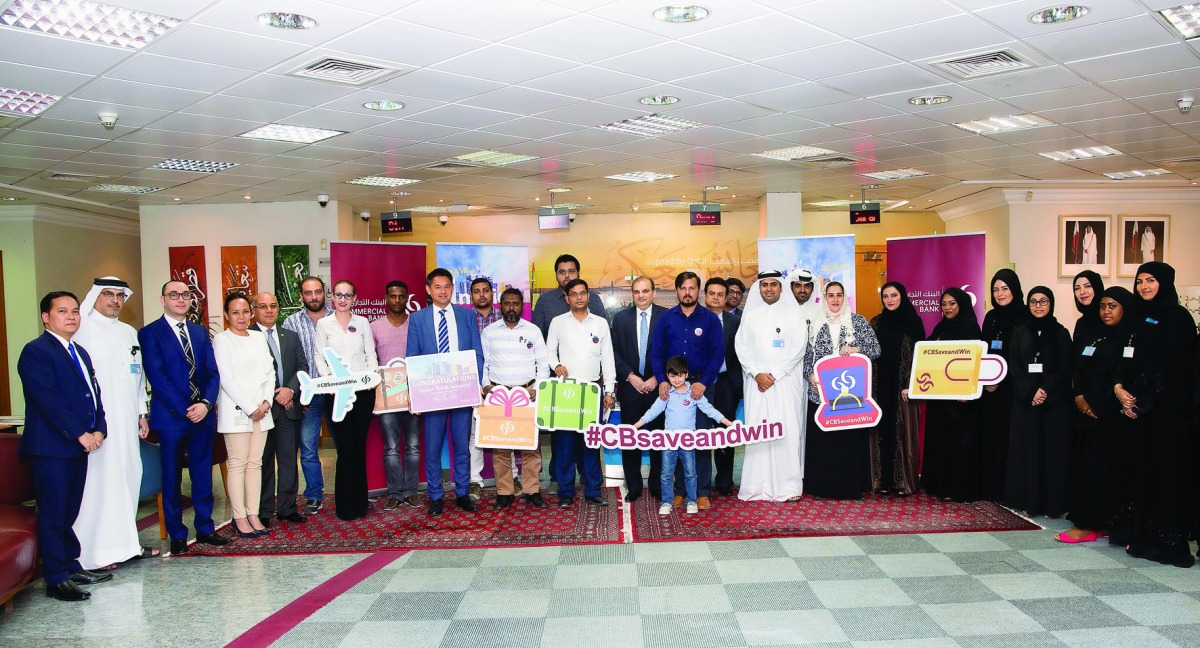 Commercial Bank officials with the latest winners of the bank’s ‘Save & Win’ campaign, at Commercial Bank’s Bin Omran branch.