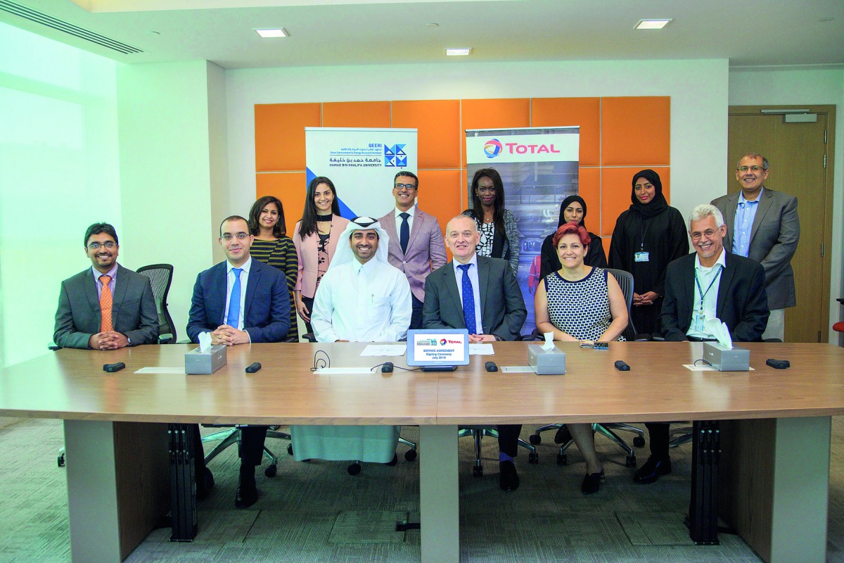 Senior officials from Total Research Center – Qatar, Hamad Bin Khalifa University’s Qatar Environment and Energy Research Institute at the signing ceremony in Doha. 