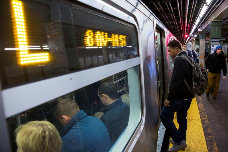 Commuters board an L train for the morning commute in New York on October 24, 2014. reuters/Lucas Jackson