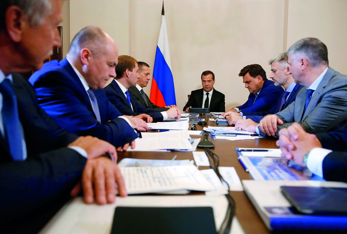 Russian Prime Minister Dmitry Medvedev holds a meeting on the consruction of a transshipment terminal for liquefied natural gas in Kamchatka region, in Petropavlovsk-Kamchatsky, Russia August 10, 2018. Sputnik/Dmitry Astakhov/Pool via Reuters