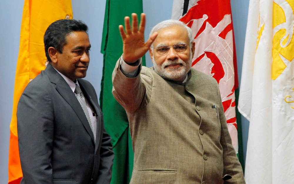 File photo of India's Prime Minister Narendra Modi (R) waves as Maldives President Abdulla Yameen looks on during the closing session of 18th South Asian Association for Regional Cooperation (SAARC) summit in Kathmandu November 27, 2014. REUTERS/Niranjan 