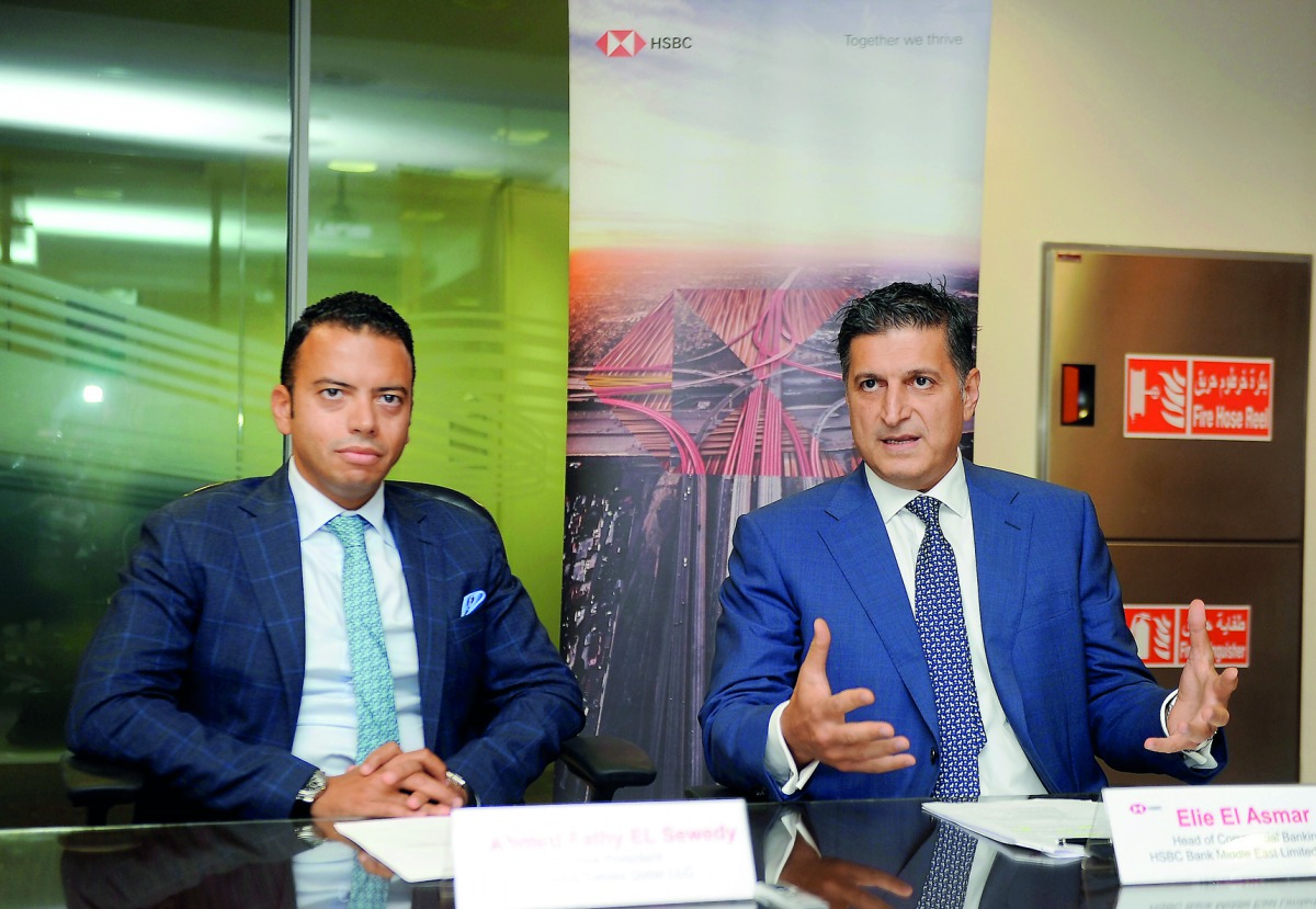 Elie El Asmar (right), Country Head of Commercial Banking, HSBC Middle East Limited, with Ahmed Fathy Al Sewedy, Vice-President, Doha Cables, speaking to The Peninsula. Pic: Abdul Basit/The Peninsula