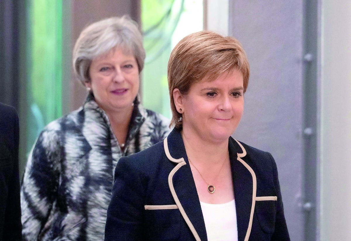 Britain's Prime Minister Theresa May and Scotland's First Minister Nicola Sturgeon arrive at the University of Edinburgh before signing the Edinburgh and South East Scotland City Region Deal in Edinburgh, Scotland, August 7, 2018.  Jane Barlow/Pool via Re