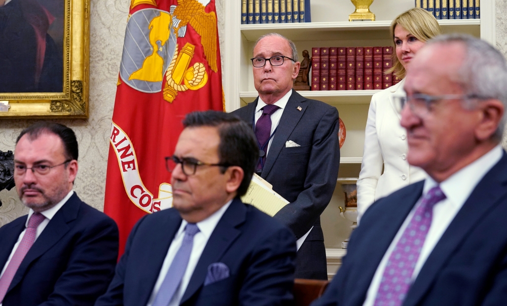 (L-R) Mexico's Foreign Minister Luis Videgaray, Mexico's Economy Minister Ildefonso Guajardo, White House chief economic adviser Larry Kudlow (standing) and Jesus Seade, Mexico's President-elect Obrador's representative in trade negotiations look on as U.