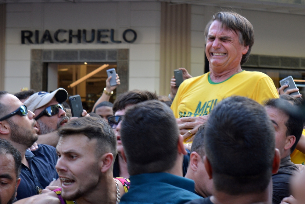 Brazilian presidential candidate Jair Bolsonaro reacts after being stabbed during a rally in Juiz de Fora, Minas Gerais state, Brazil September 6, 2018. Picture taken September 6, 2018. Reuters/Raysa Campos Leite 