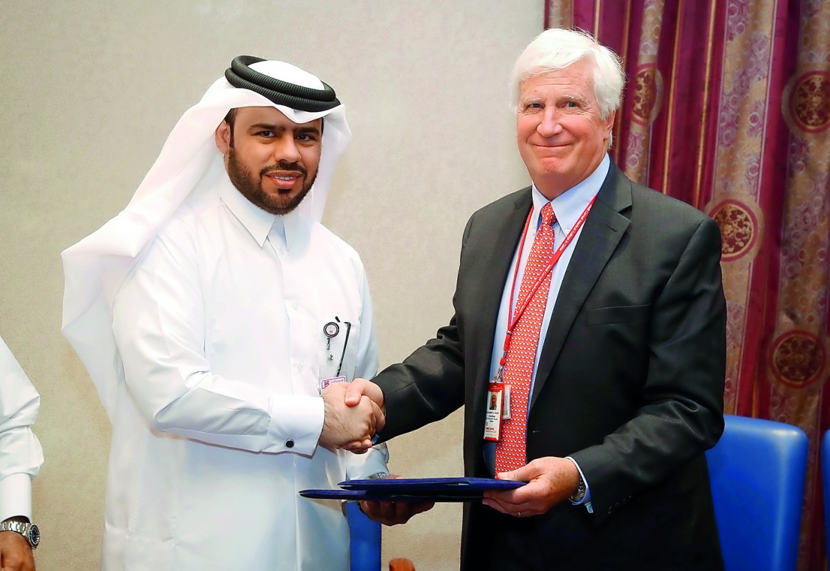 Khaled Emadi, the CEO of Al Ahli Hospital, and Dr Robert Crone, Vice-Dean for Clinical and Faculty Affairs at WCM-Q, during the signing ceremony, yesterday.  Pic: Hussain Sayed