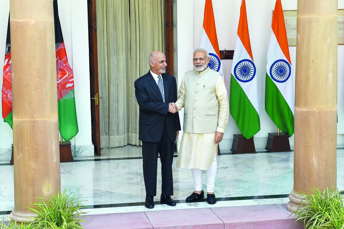 Indian Prime Minister Narendra Modi (R) shakes hand with Afghan President Mohammad Ashraf Ghani before a meeting at Hyderabad House in New Delhi on September 19, 2018. AFP / Money Sharma
