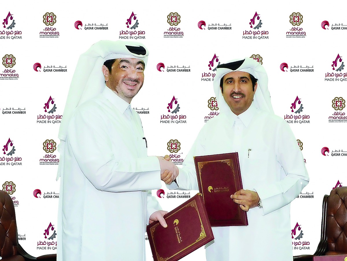 Qatar Chamber Director-General Saleh bin Hamad Al Sharqi (right) and Manateq’s CEO Fahad Rashid Al Kaabi shake hands after signing the sponsorship agreement at Qatar Chamber headquarters.