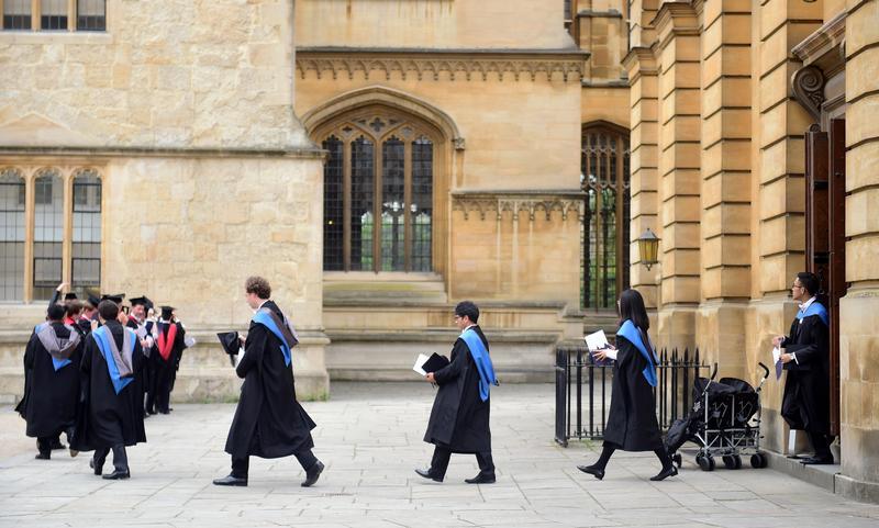 Graduates leave the Sheldonian Theatre after a graduation ceremony at Oxford University, in Oxford, Britain July 15, 2017. Reuters/Hannah McKay