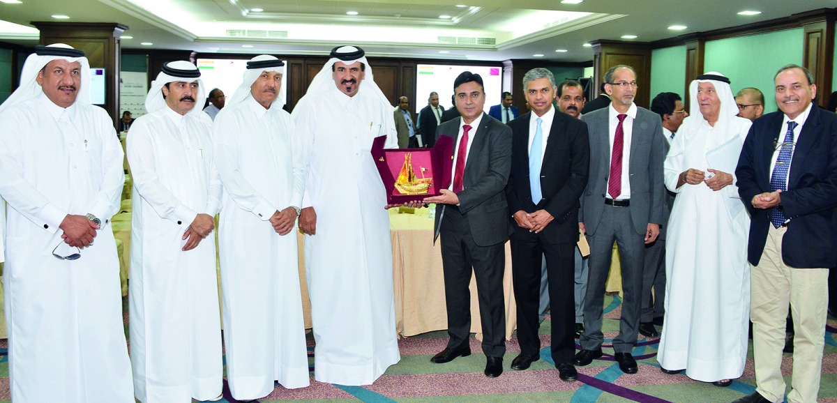 Qatar Chamber Vice-Chairman Mohamed bin Ahmed bin Towar Al Kuwari (fourth left) with Triviyan K Kalra (centre), CEO of K-flex India Co; P Kumaran (fourth right), Ambassador of India to Qatar, and other Qatar Chamber and Indian officials.