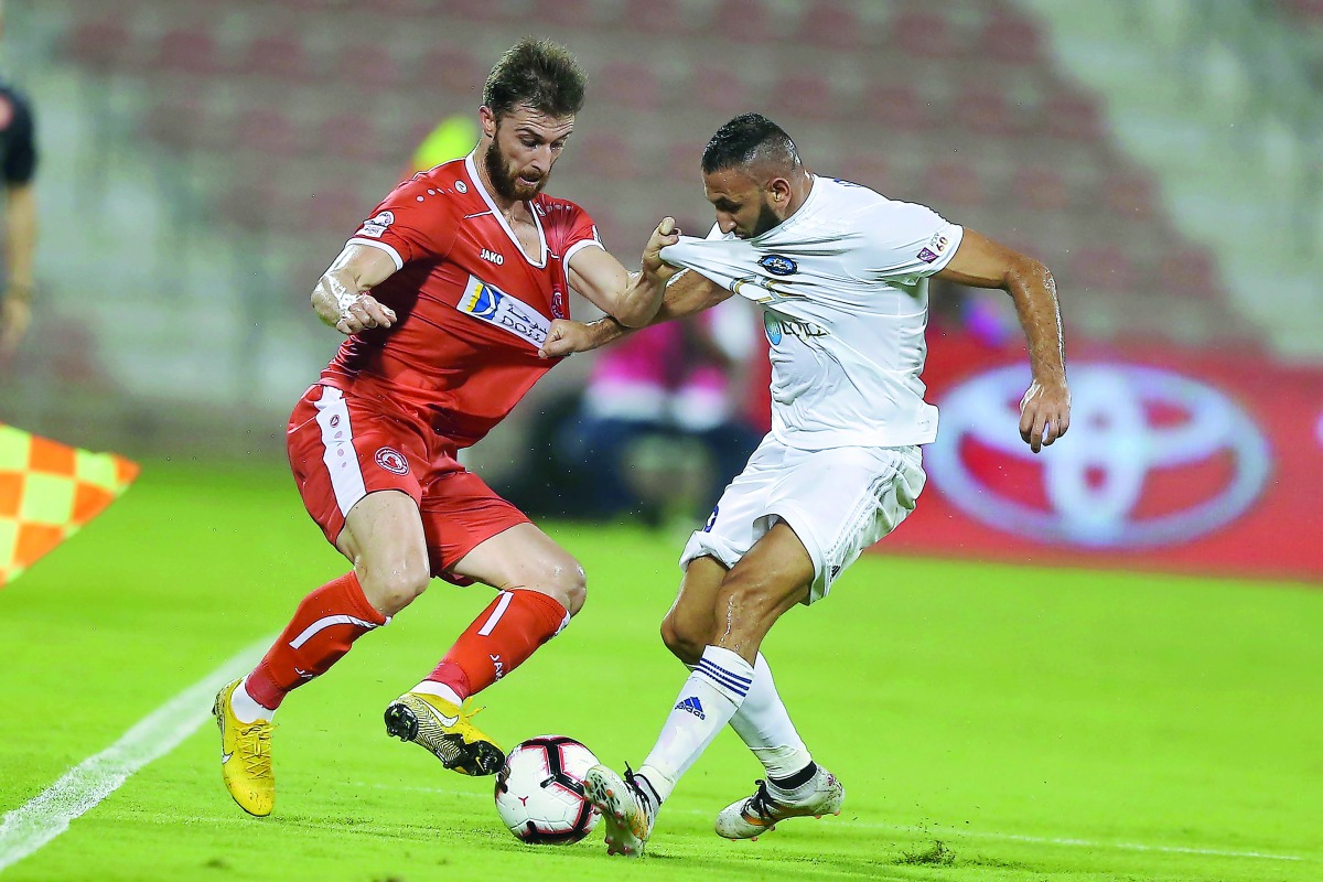 Players of Al Arabi and Al Sailiya vie for ball possession during their QNB Stars League match at Al Arabi Stadium in Doha yesterday.