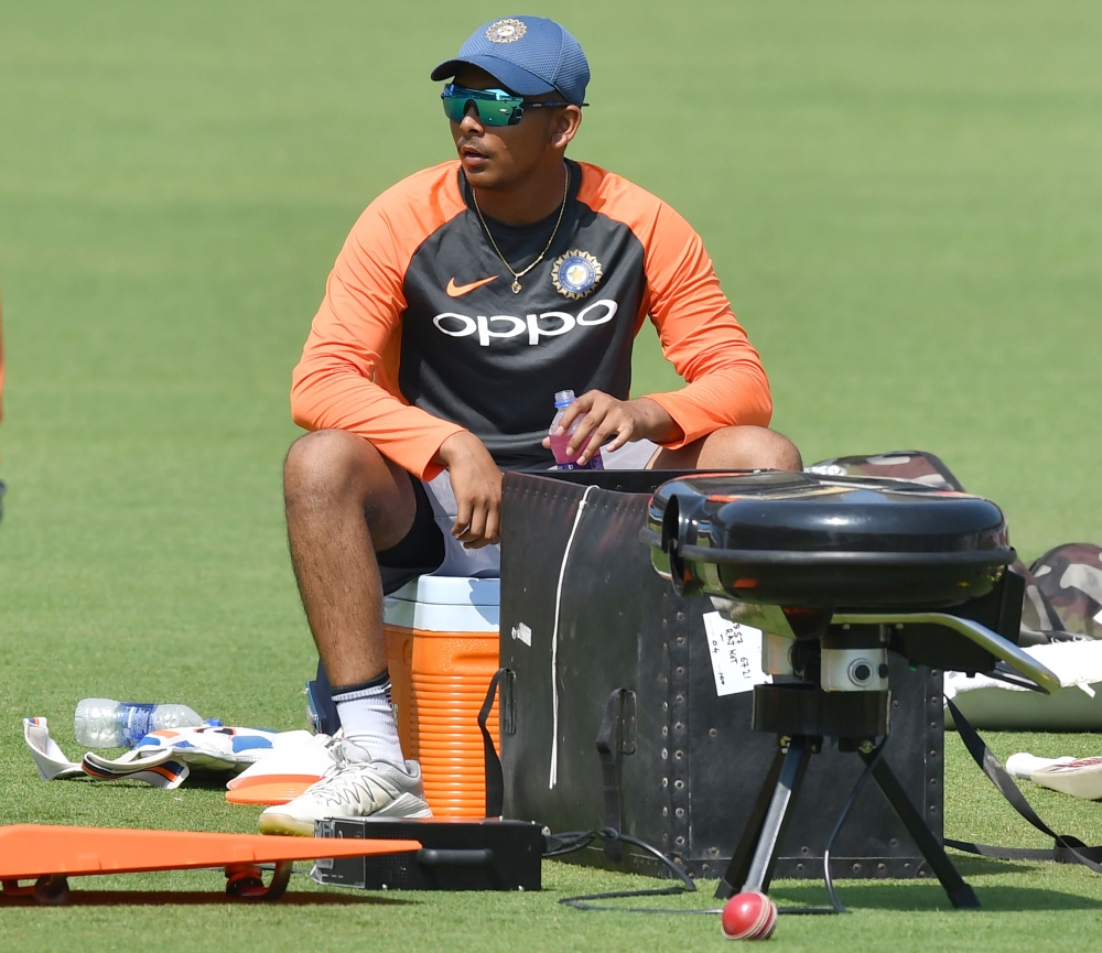 Indian cricketer Prithvi Shaw looks on during a training session ahead of the first Test cricket match between India and West Indies at the Saurashtra Cricket Association stadium in Rajkot on October 3, 2018. GETTYOUT / AFP / PUNIT PARANJPE