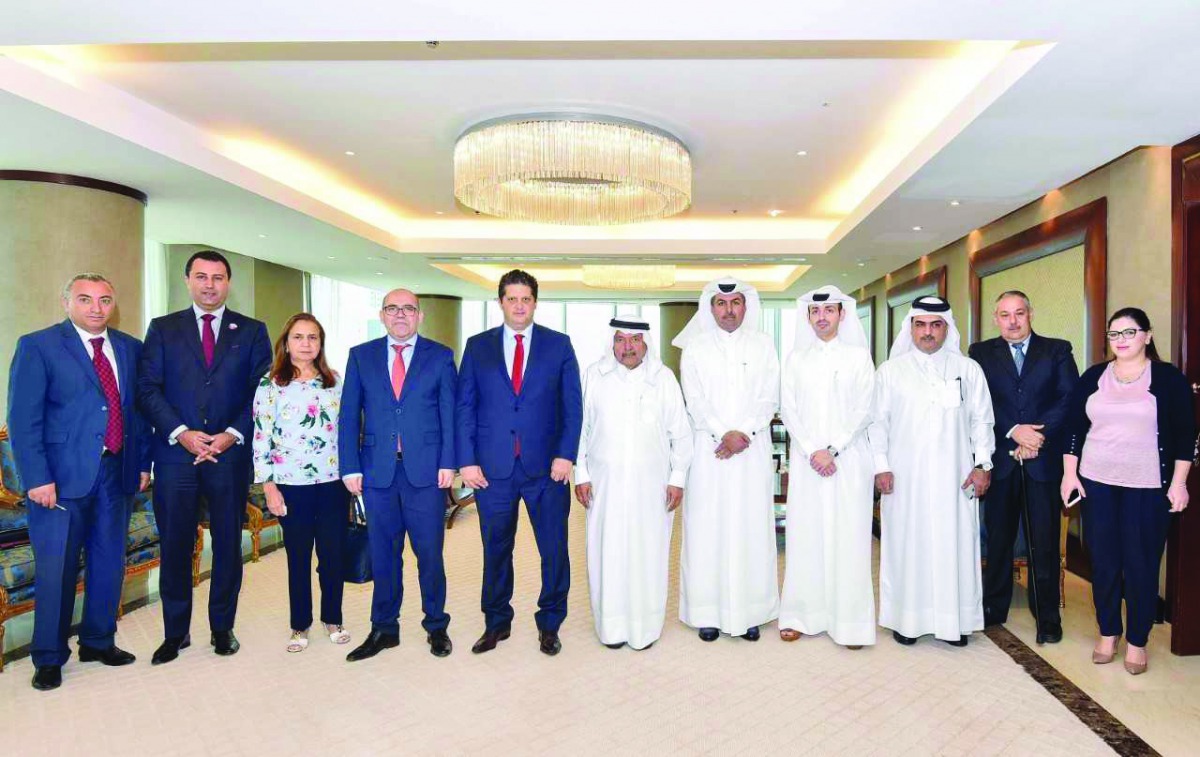 Sheikh Faisal bin Qassim Al Thani (centre), QBA Chairman, and Omar Al Bahi (fifth left), Tunisia’s Minister of Commerce, along with QBA members and Tunisian visiting delegation, yesterday.