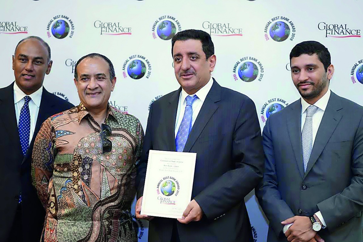Mohamad Ismail Mandani Al Emadi (second right), Commercial Bank Board Member; Commercial Bank Group Chief Executive Officer Joseph Abraham (second left); Parvez Khan - EGM, Treasury & Investment (left); and Fahad Badar, EGM, International Banking during t