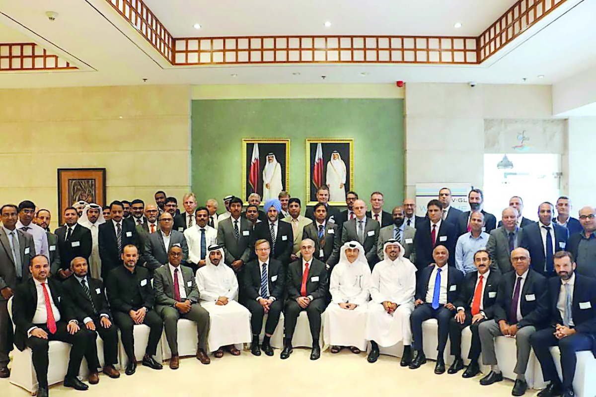 Nakilat officials and Qatar Shipping Forum participants on the sidelines of the event.