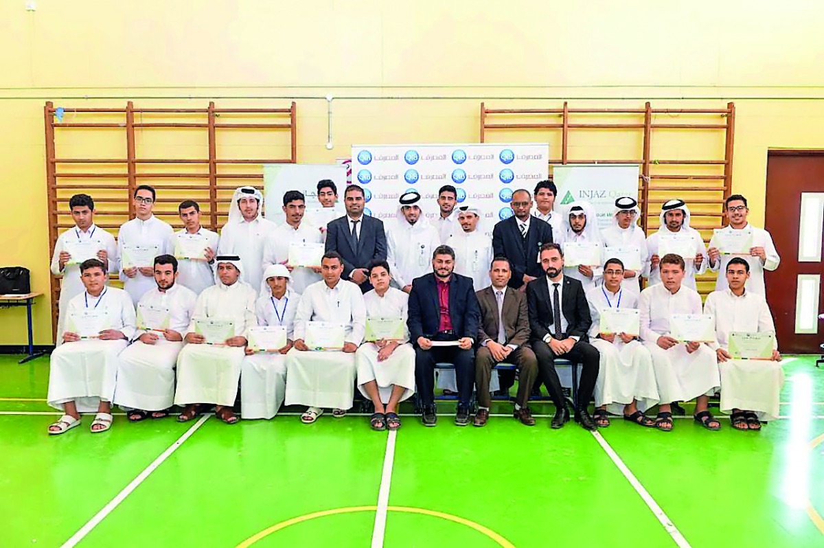 Participants with QIB officials during the financial literacy program.