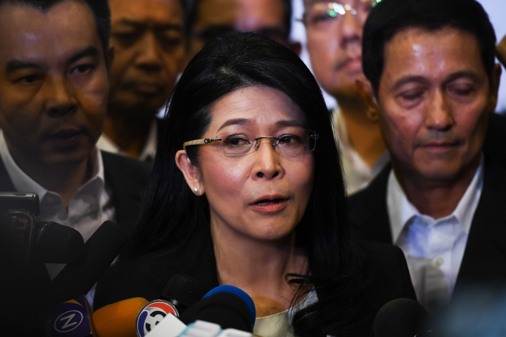 Thai politician Khunying Sudarat Keyuraphan (C), speaks to journalists after being named Puea Thai Party's strategy committee chairwoman in Bangkok on October 28, 2018. / AFP / Lillian SUWANRUMPHA 