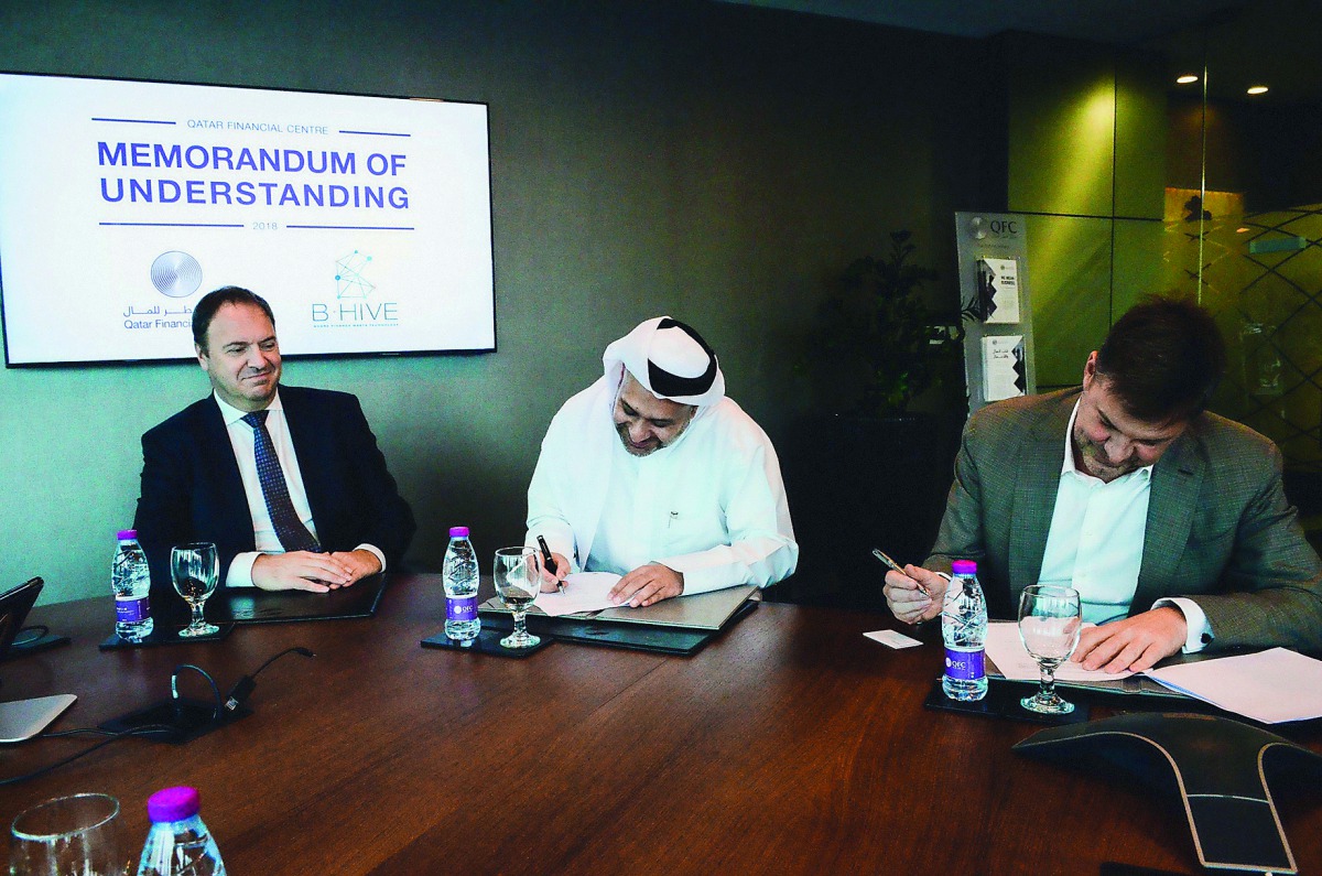 Yousuf Mohamed Al Jaida (centre), Chief Executive Officer of QFC; Wim De Waele (right), CEO and Managing Partner of B-Hive; and Dr Bart De Groof, Ambassador for Belgium to Qatar, during the signing ceremony.
