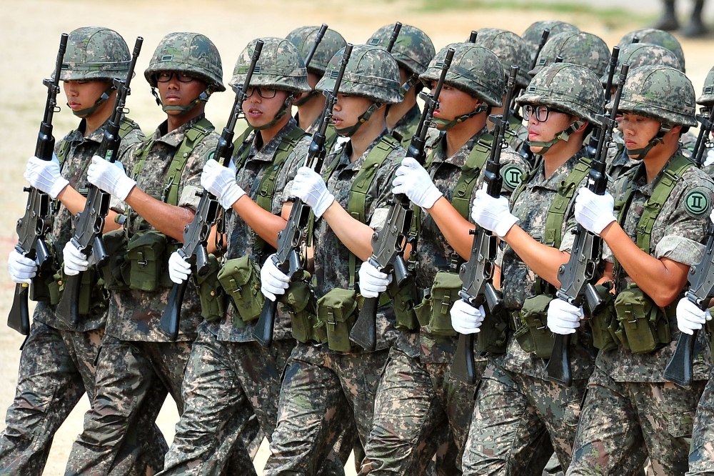 (FILES) This file photo taken on June 22, 2013 shows South Korean soldiers marching during a ceremony for a re-enactment of the battle of Chuncheon at the beginning of the 1950-53 Korean War, in Chuncheon.AFP