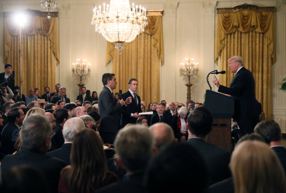CNN's Jim Acosta (L) questions US President Donald Trump during his news conference following Tuesday's midterm U.S. congressional elections at the White House in Washington, U.S., November 7, 2018. Reuters/Jonathan Ernst