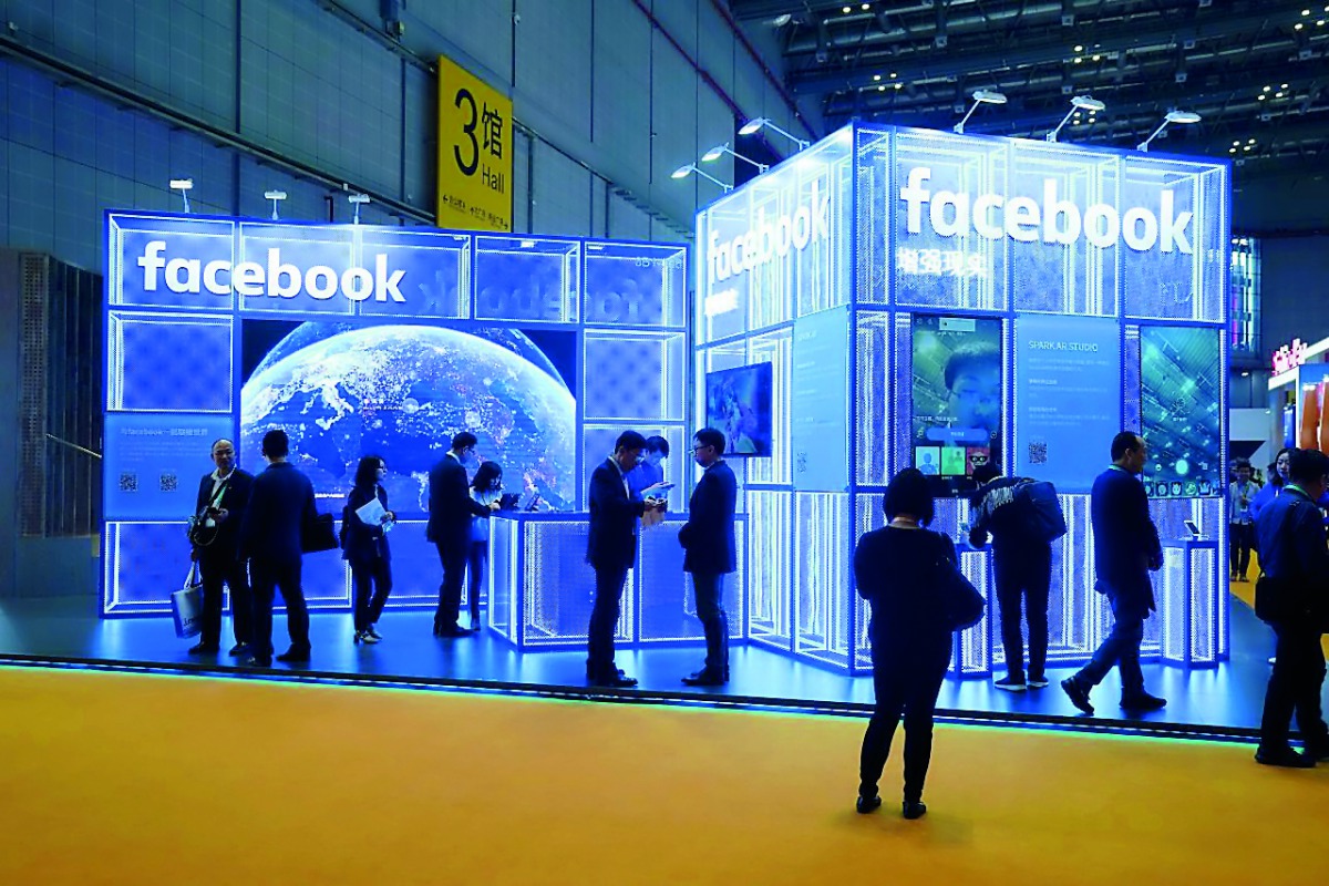 Facebook signs are seen during the China International Import Expo (CIIE), at the National Exhibition and Convention Center in Shanghai, China November 5, 2018. Reuters/Aly Song