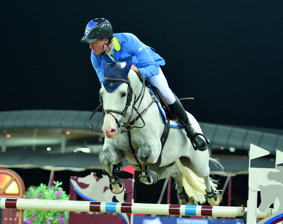 German rider Christian Ahlmann guides Caribis Z over an obstacle on his way to win the  Doha 2018 CSI5* 1.55m event during the final round of the Longines Global Champions Tour yesterday.