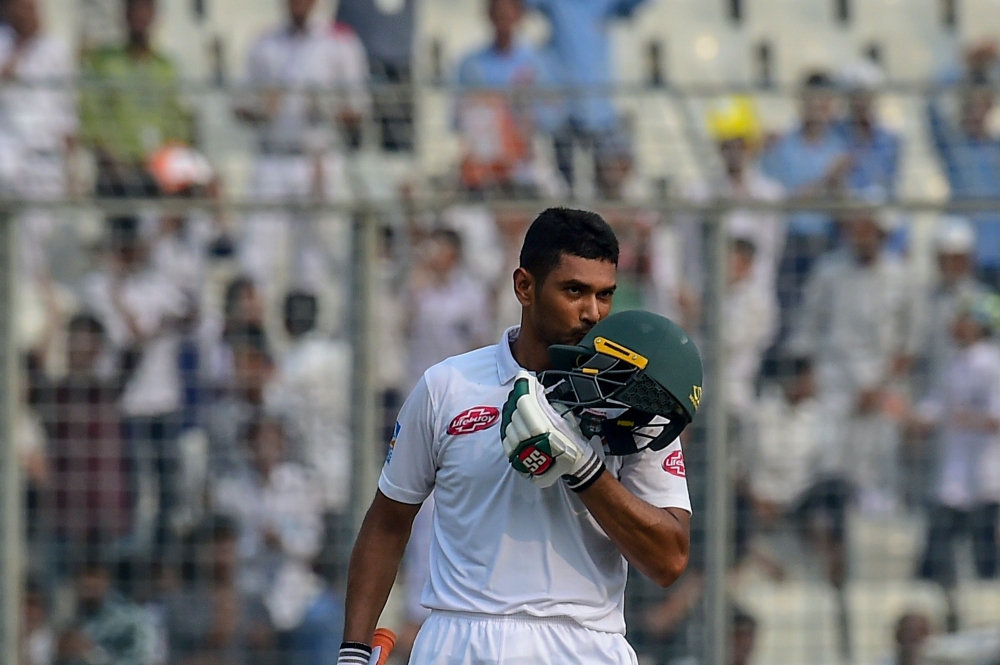 Bangladesh cricket captain Mohammad Mahmudullah reacts after scoring a century during the fourth day of the second Test cricket match between Bangladesh and Zimbabwe at the Sher-e-Bangla National Cricket Stadium in Dhaka on November 14, 2018. / AFP / MUNI