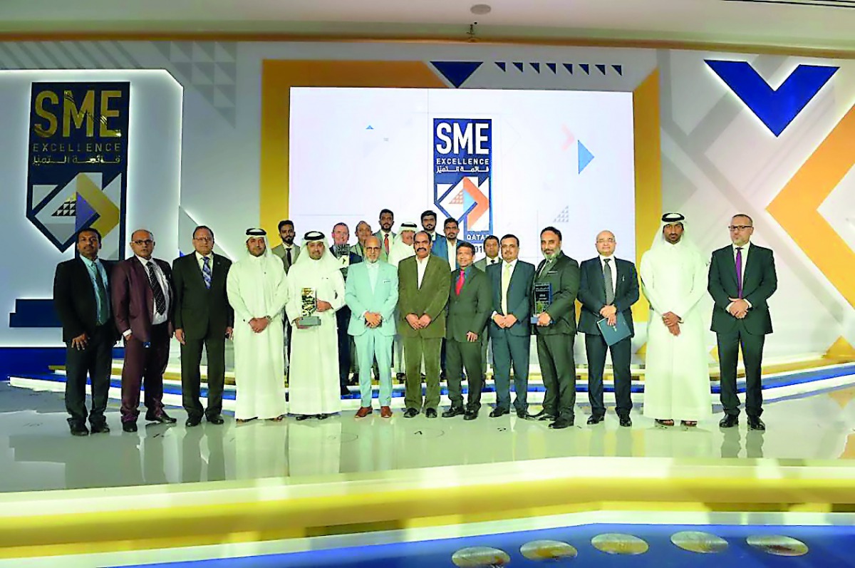 Doha Bank CEO Dr R Seetharaman and other officials with the winners. 
