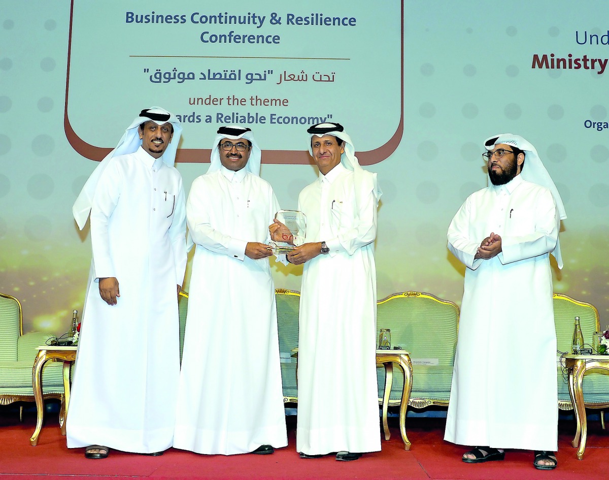 H E Dr Mohammed bin Saleh Al Sada presenting a memento to the Board Member of Qatari Businessmen Association, Sheikh Hamad bin Faisal Al Thani,  during the opening of the 2nd Business Continuity and Resilience Conference held at the Sheraton Grand Doha Re