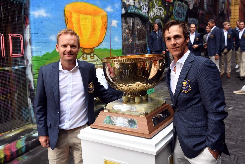Team Denmark's Soren Kjeldsen (L) and Thorbjorn Olesen (R) pose with the World Cup of Golf trophy in Melbourne on November 20, 2018. AFP / William West 