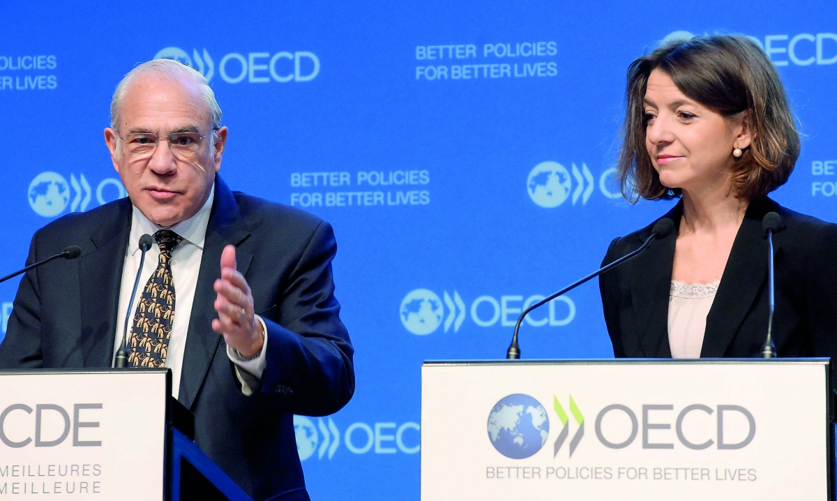 Secretary-General of the Organisation for Economic Co-operation and Development (OECD) Jose Angel Gurria (L) and New Chief Economist of the Organisation for Economic Co-operation and Development (OECD) Laurence Boone addresses a press conference to presen