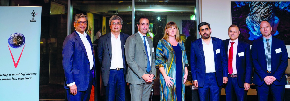 ICAEW members and panelists pose for a group picture.