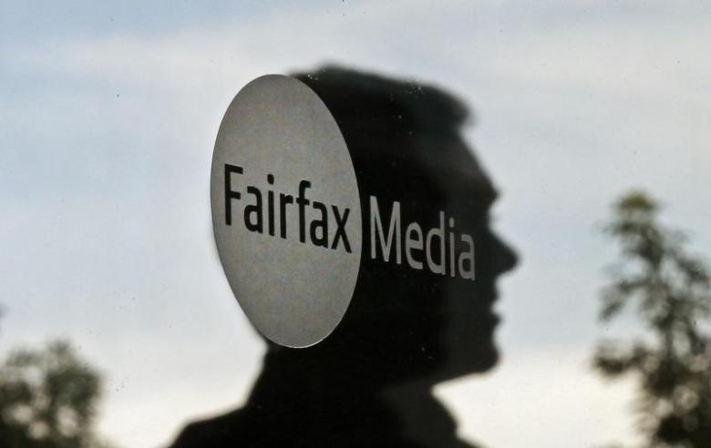 A man leaves the Fairfax Media headquarters in Sydney August 23, 2012. Reuters/Daniel Munoz 