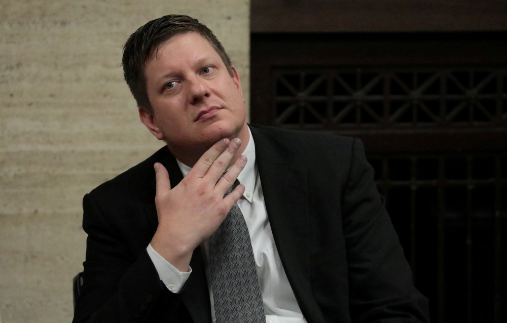 Chicago police officer Jason Van Dyke looks as the jury sends a question to Judge Vincent Gaughan (not shown) during deliberations in Van Dyke's murder trial of 17-year old Laquan McDonald, in Chicago, Illinois, US, October 5, 2018. Antonio Perez/Chicago 