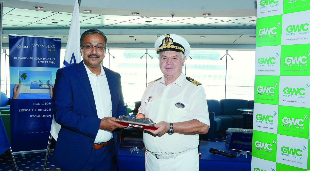 GWC Senior Director of Freight Forwarding, Bobby George, handing the crest to MSC Lirica Captain Raffaele Ponti. 