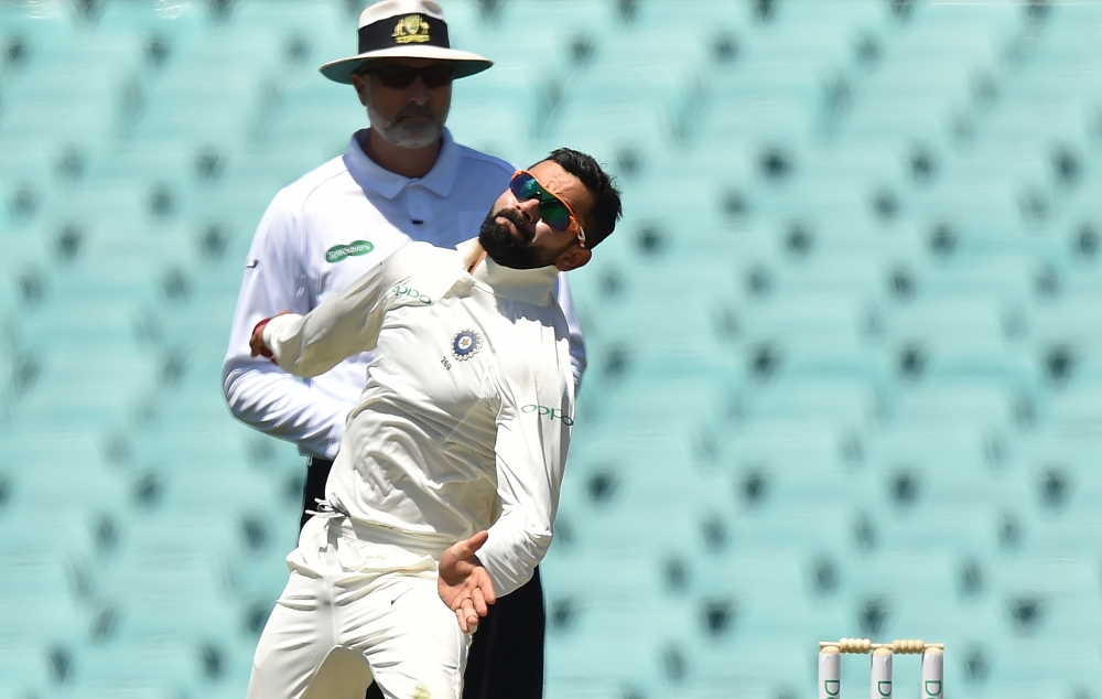 India's captain Virat Kohli bowls to Australia's Harry Nielsen on the fourth day of the tour match against Cricket Australia XI at the SCG in Sydney on December 1, 2018. AFP / PETER PARKS 