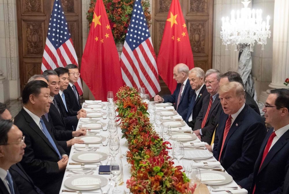US President Donald Trump (2-R) US Secretary of the Treasury Steven Mnuchin (R) and members of their delegation have dinner with China's President Xi Jinping (3-L) and Chinese government representatives, at the end of the G20 Leaders' Summit in Buenos Air