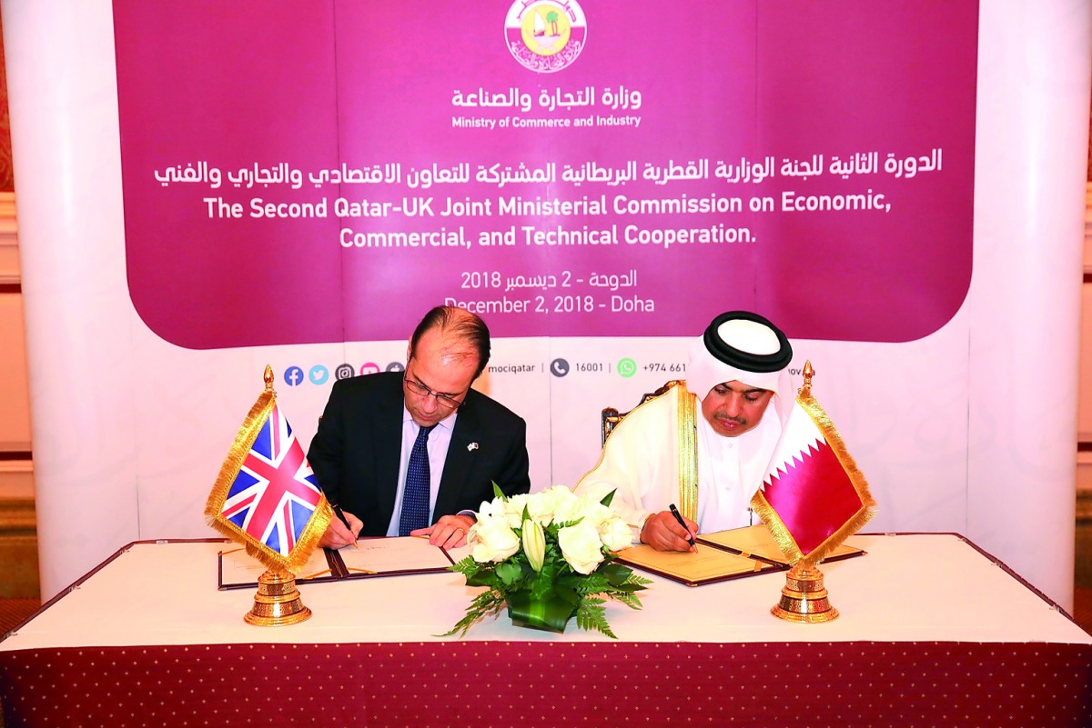 H E Ali bin Ahmed Al Kuwari (right), Minister of Commerce and Industry, and George Hollingbery, the UK’s Minister of State for Trade Policy, signing the minutes.