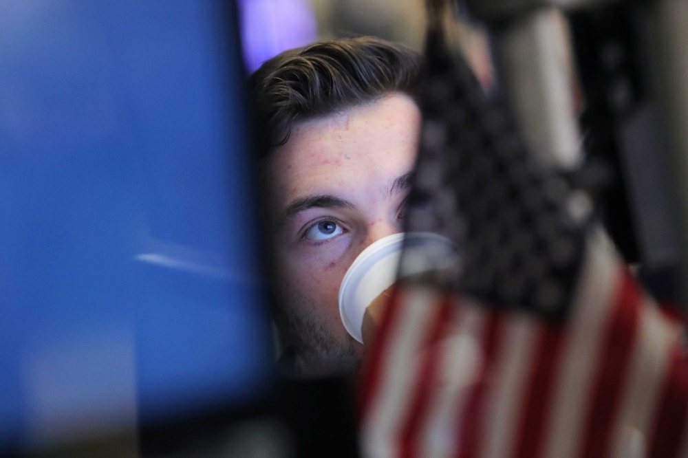 A trader works on the floor at the New York Stock Exchange (NYSE) in New York City, U.S., November 30, 2018. REUTERS/Brendan McDermid